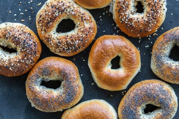 Baked bagels with different topping.
