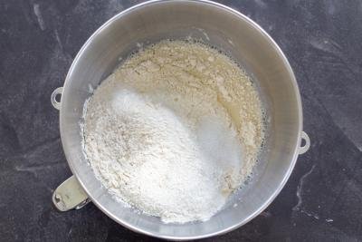 Flour added to the other ingredients in a bowl.