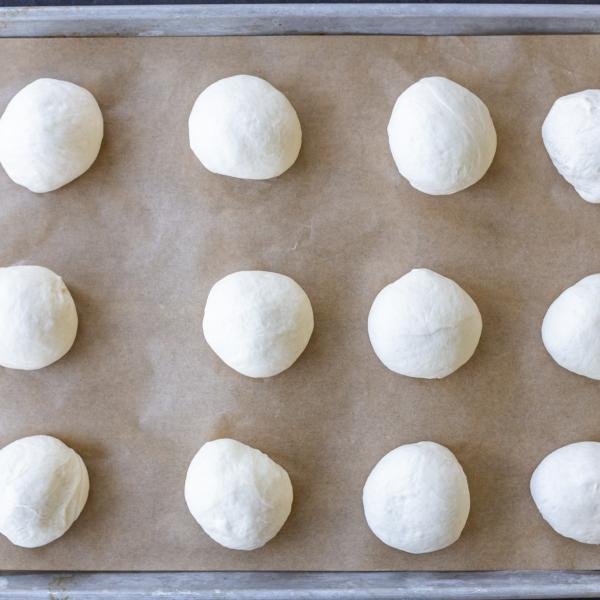 Dough divided on a baking sheet.
