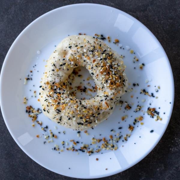 Bagels on a plate with topping.