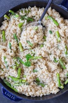 Asparagus Risotto in a pan with spoon.