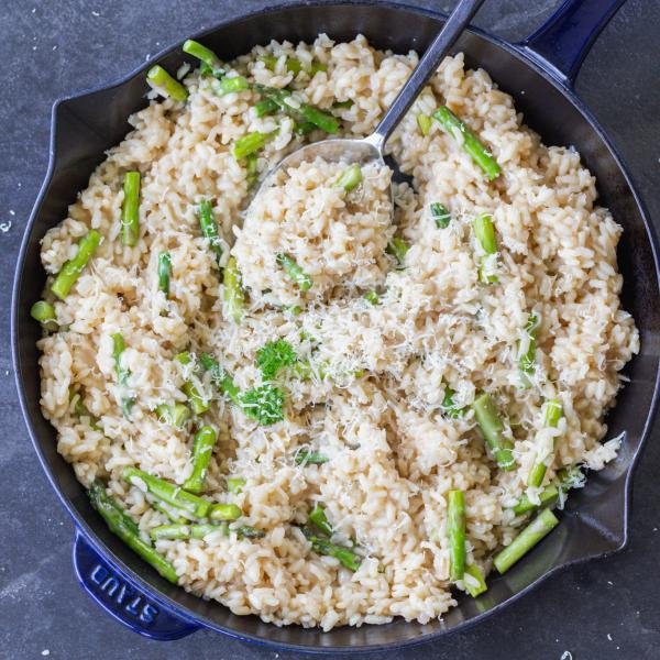 Asparagus Risotto in a pan with spoon.