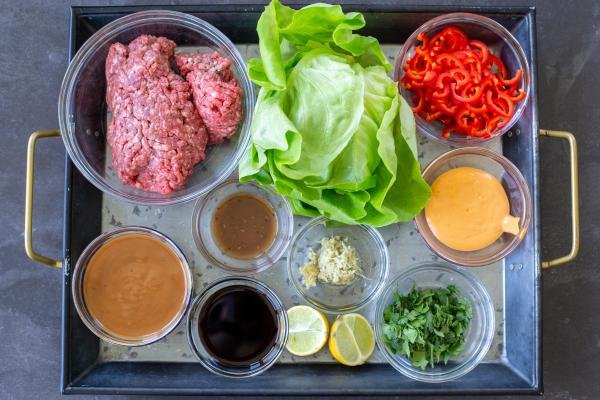 Ingredients for beef lettuce wraps on a tray.
