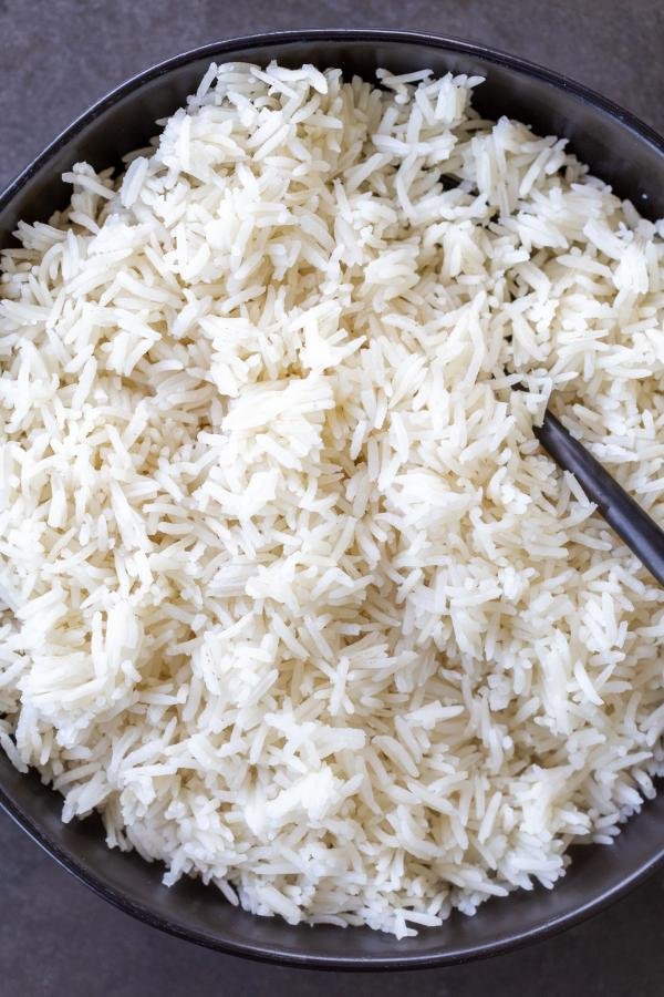 Basmati rice in a bowl with a spoon. 