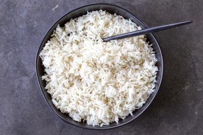 Basmati rice in a bowl with a spoon.