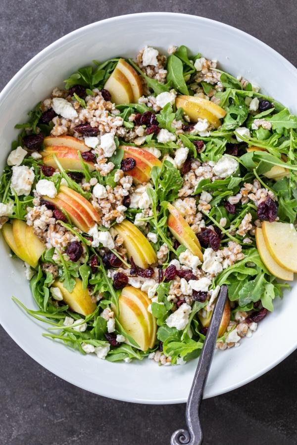 Farro Salad in a bowl with serving spoon. 