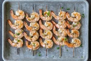 Grilled shrimp on a baking sheet.