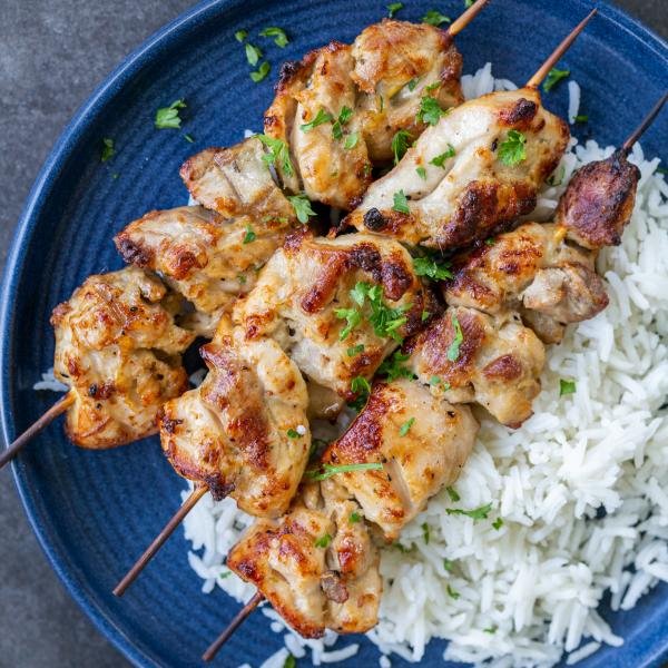 Oven-Baked Chicken Kabobs on a plate with rice.