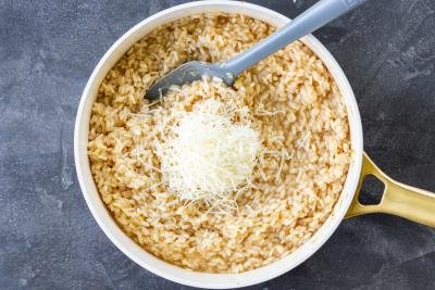 Parmesan cheese in a pan with risotto.