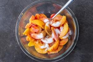 Peaches with sugar and cinnamon in a bowl