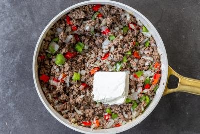 Cooked veggies with ground beef and cream cheese.