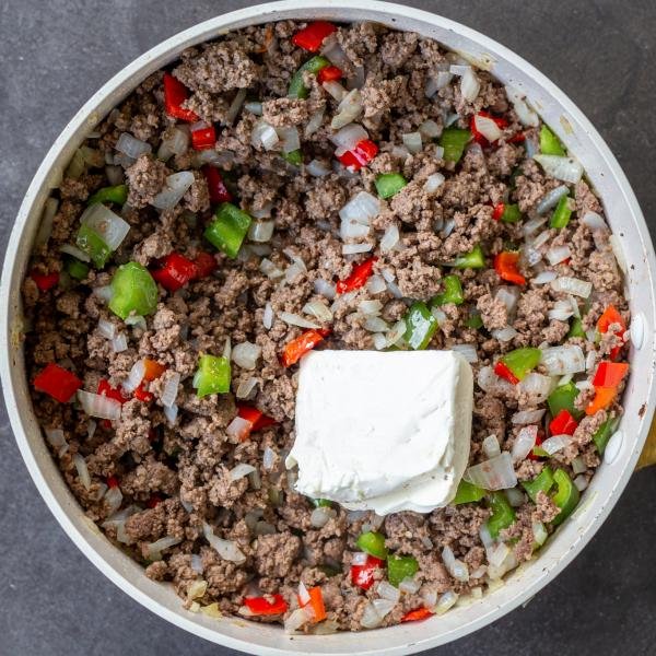 Cooked veggies with ground beef and cream cheese.
