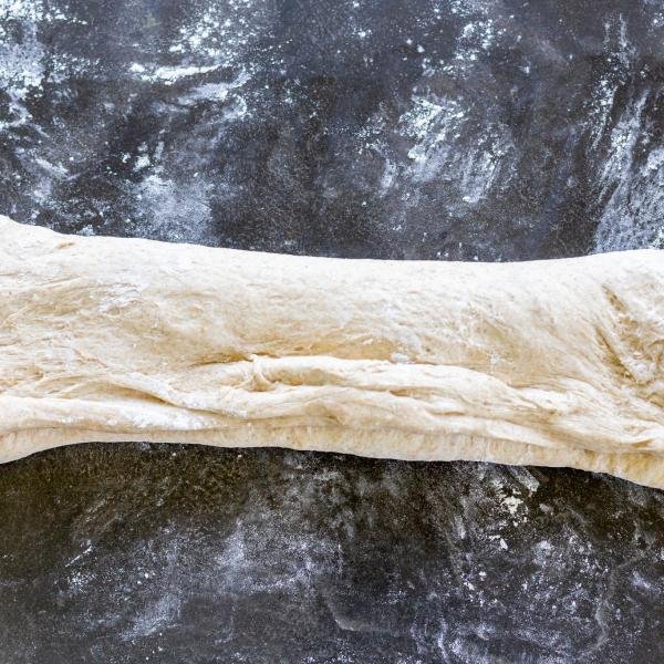 Folded bread dough on a counter