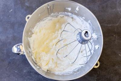 Whipping cream in a mixing bowl.
