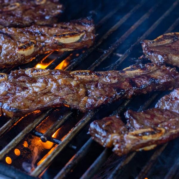 Grilled Beef Galbi on a grill.