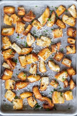 Homemade Croutons on a tray with herbs