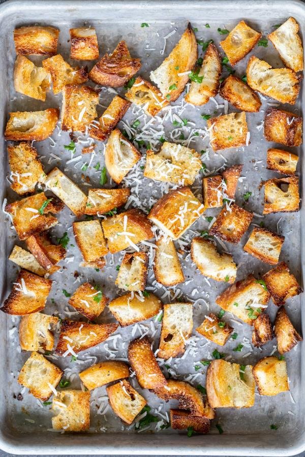 Homemade Croutons on a tray with herbs 