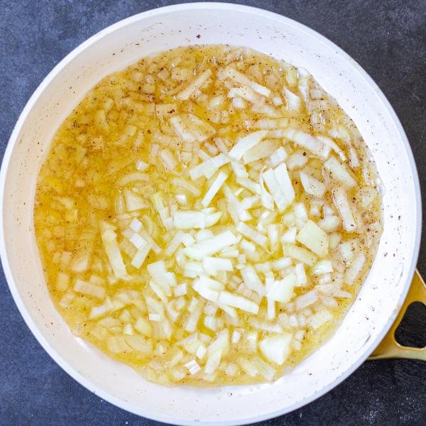 Onion and butter in a pan.