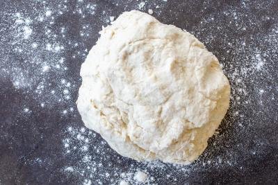 Biscuits dough on a floured surface.