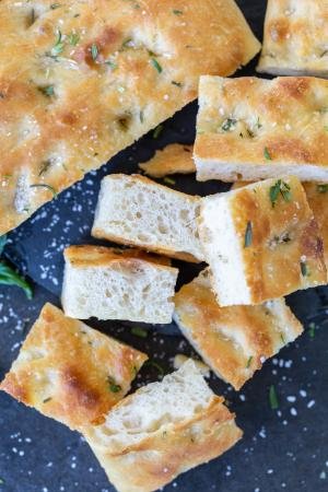 Sliced Focaccia with salt and other herbs.