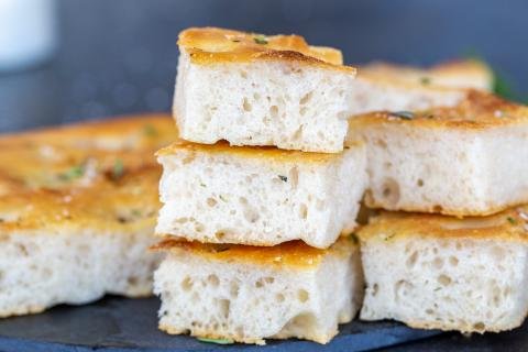 Pieces of Focaccia stalked on top of each other.