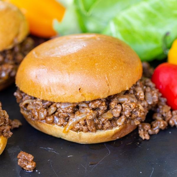 Sloppy Joes with veggies on a serving tray.