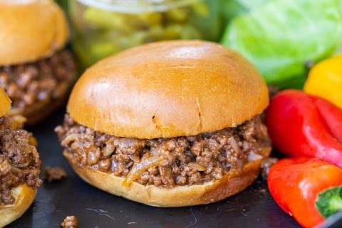 Sloppy Joes with veggies on a serving tray.