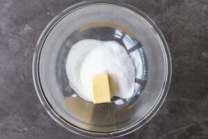 Butter and sugar in a bowl.
