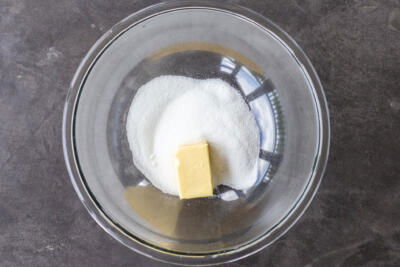 Butter and sugar in a bowl.