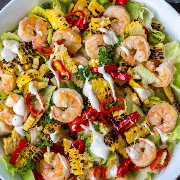 Shrimp Salad with Lettuce in a bowl with dressing.