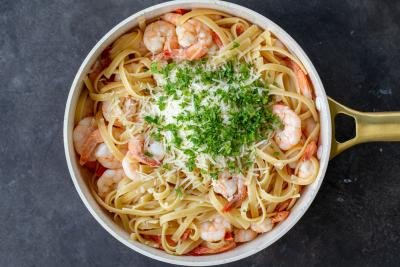 All the shrimp linguine ingredients in a pan.