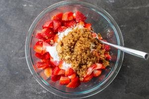 Strawberry cobbler filling ingredients in a bowl.