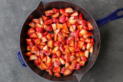 Chopped strawberries in a pan.