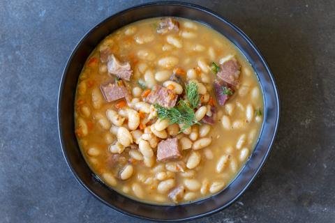 Ham and bean soup in a bowl.