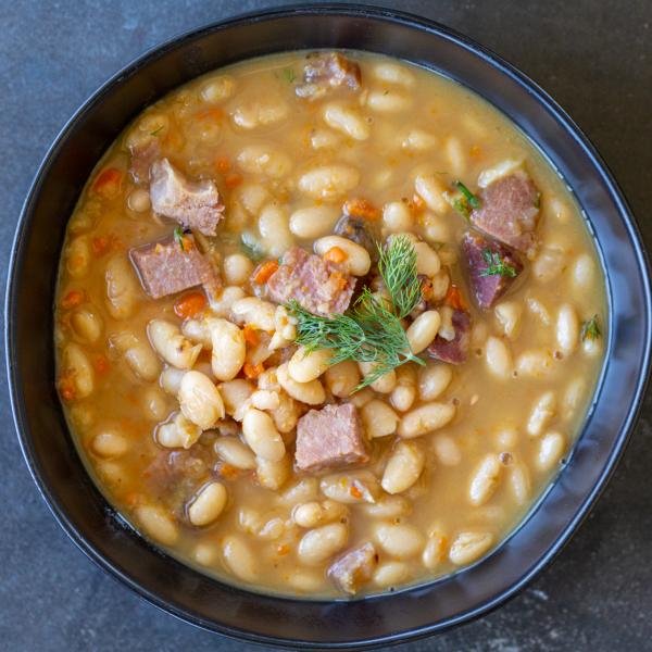 Ham and bean soup in a bowl.