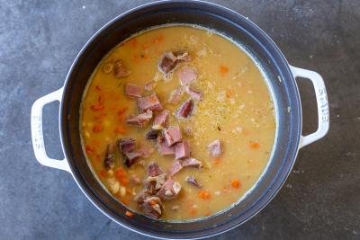 Ham cut into pieces added to bean soup.