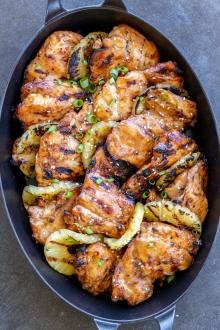 Grilled Huli Huli chicken on a serving tray.