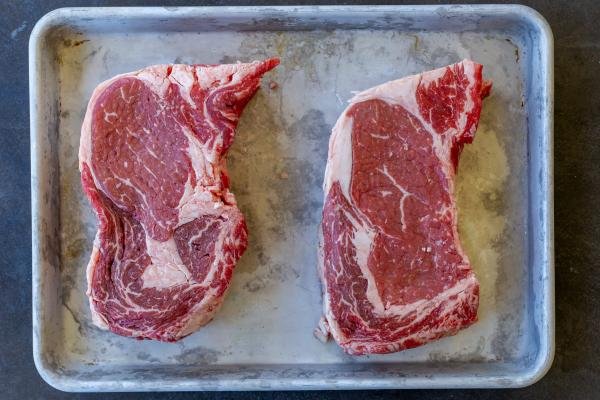 Ribeye on a baking sheet.