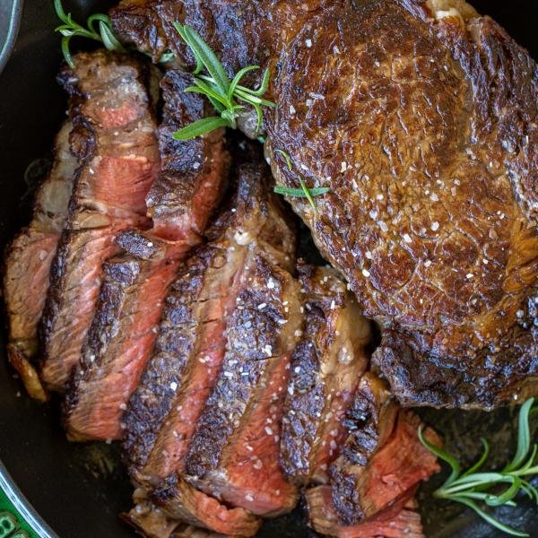 Oven baked ribeye in a pan.