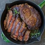 Baked ribeye in a pan, sliced and whole piece/.