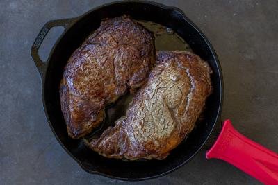 Browned ribeye on a cast iron.