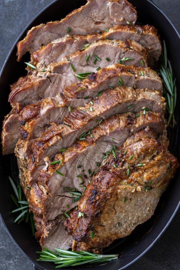 Herbs with roasted pork shoulder roast. 