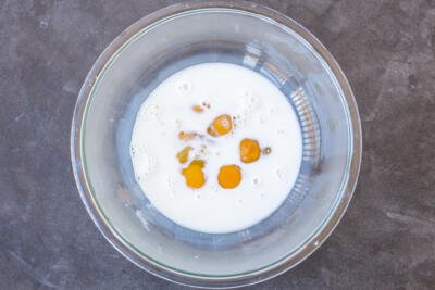 Eggs with milk in a bowl.