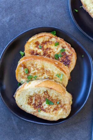 A few slices of Savory French Toast on a plate.