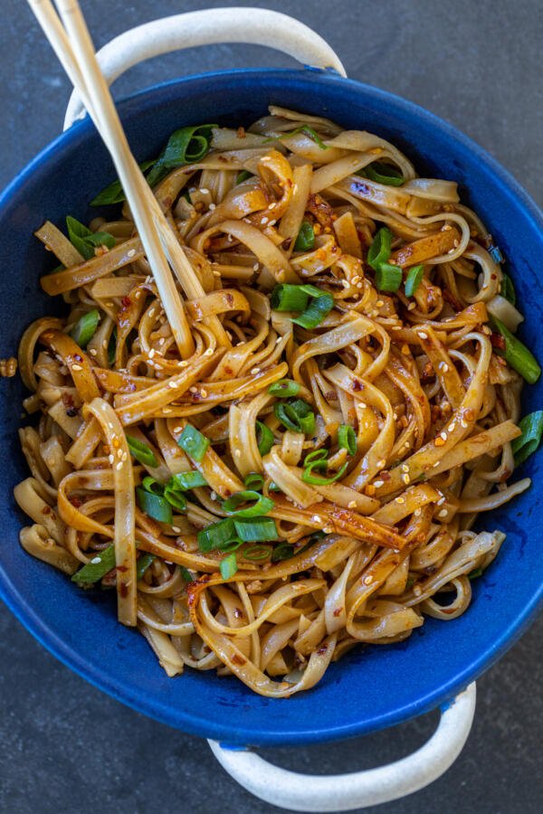 Noodles with chop sticks in a bowl.