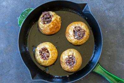 Baked apples on a baking pan.