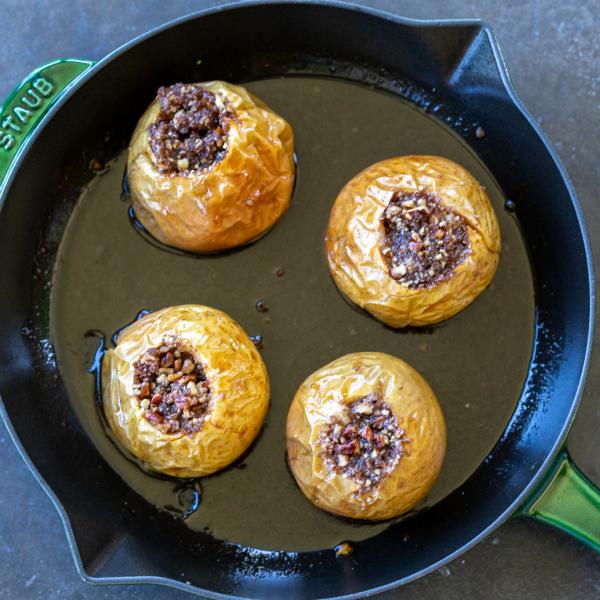 Baked apples on a baking pan.