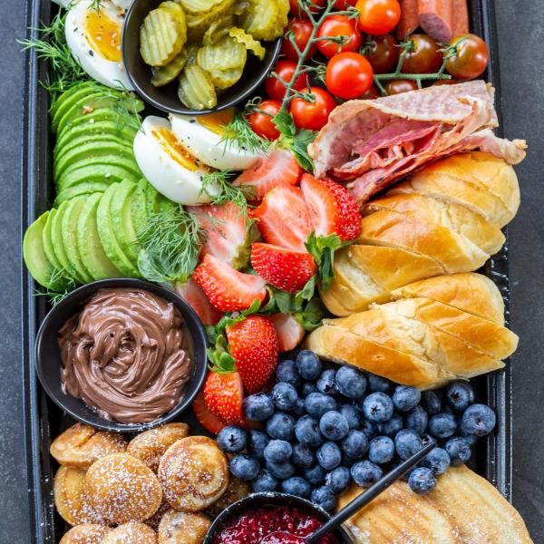 Breakfast charcuterie board with variety of options.
