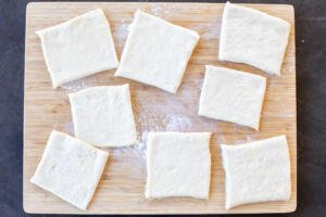 Danish dough on a cutting board.