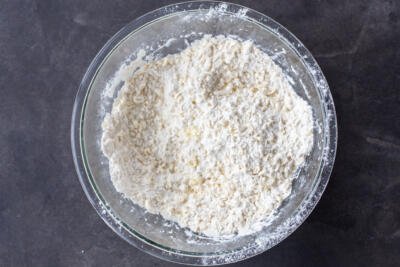 Flour with butter in a bowl.